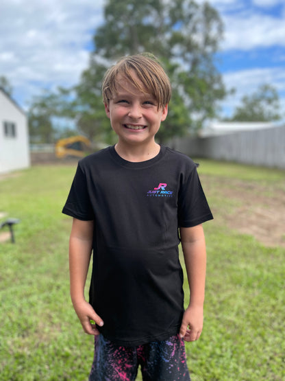 Black shirt featuring “JR Just Race Automotive” logo in bright pink, blue and purple. The back collar carries the words “Tuned by JR”. JR is an experienced car tuner who specialises in tuning drag cars, off-street racing and no-prep events in Australia.